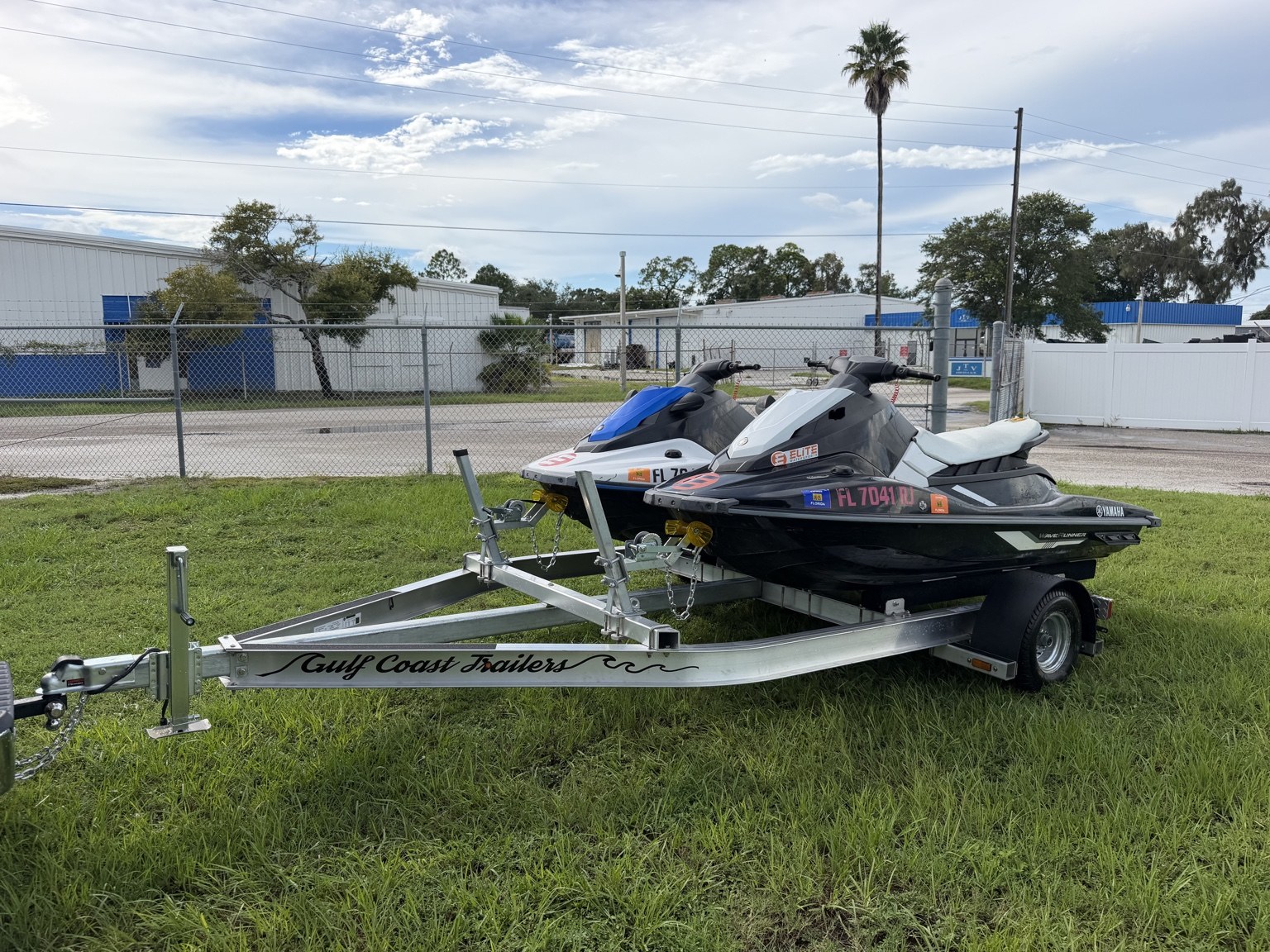 Commercial heavy-duty double jet ski trailer for lessons and rentals · front three-quarter view