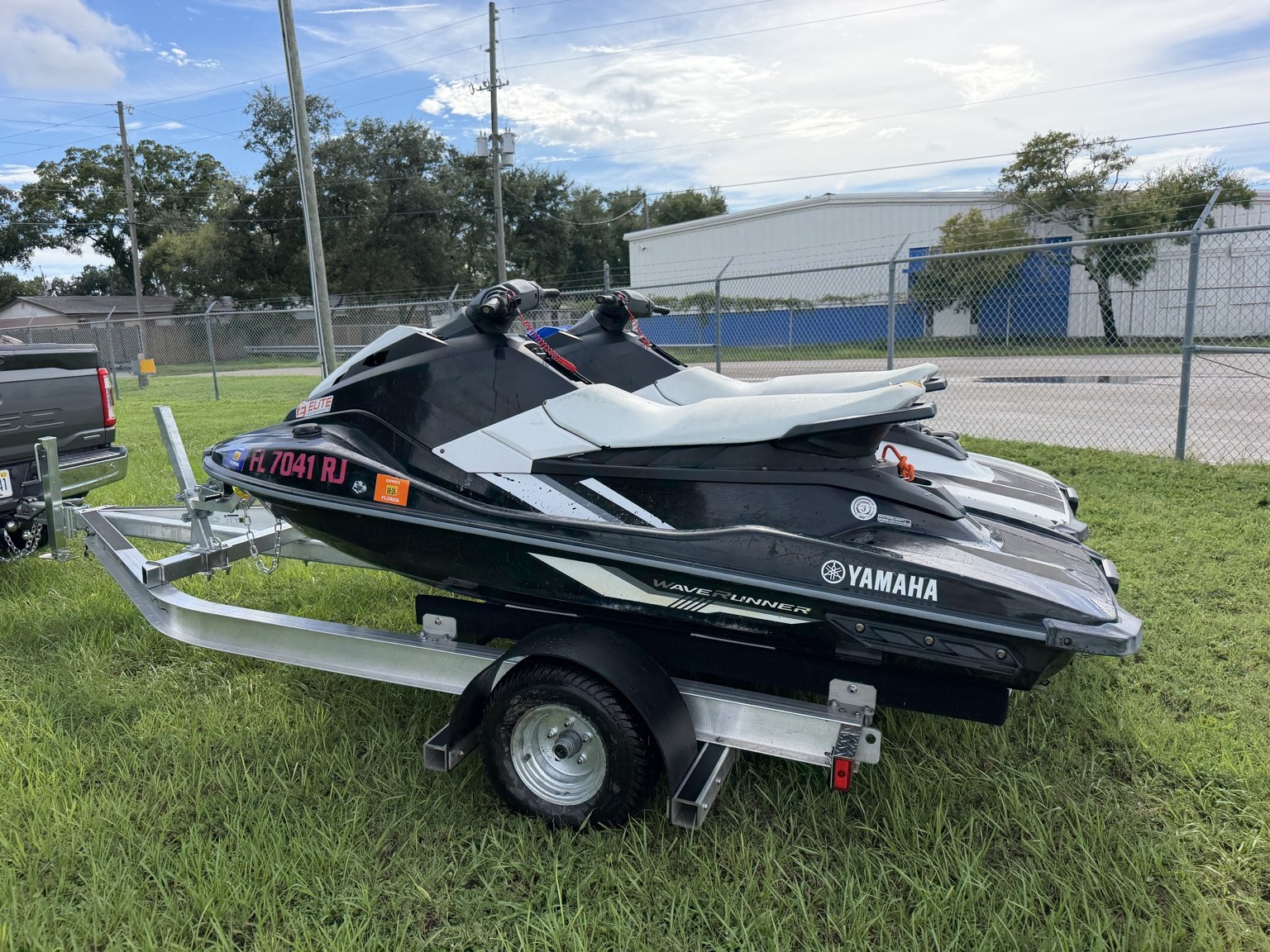 Commercial heavy-duty double jet ski trailer for lessons and rentals · rear three-quarter view