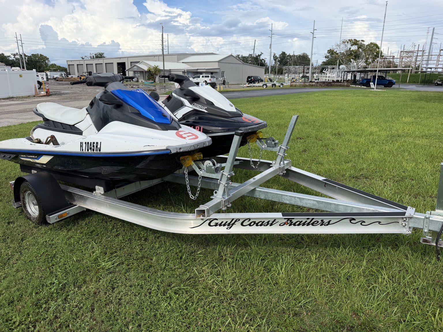 Commercial heavy-duty double jet ski trailer for lessons and rentals · loaded front and side view