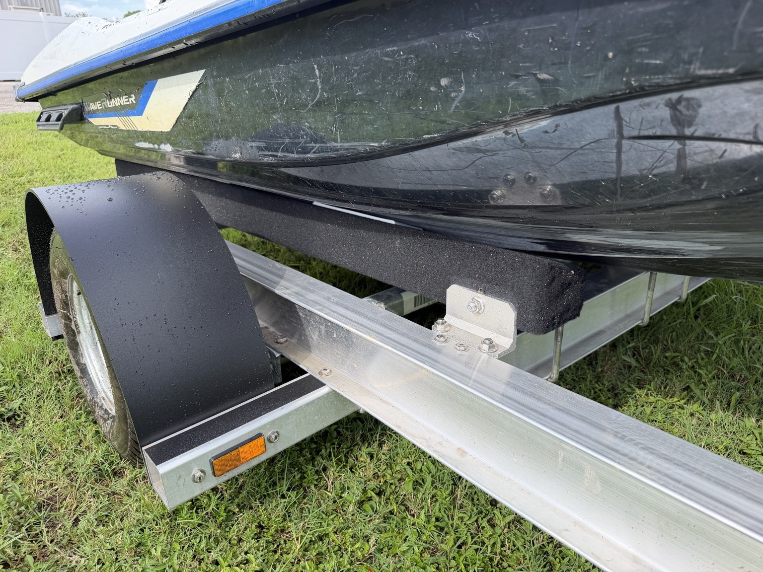 Commercial heavy-duty double jet ski trailer for lessons and rentals · frame and bunk detail