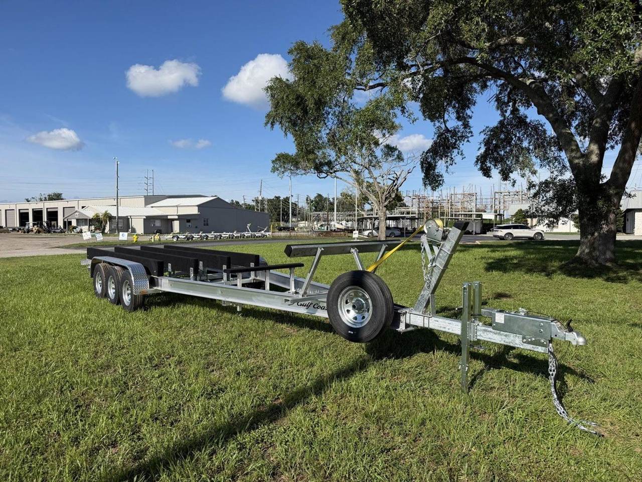 Custom commercial triple-axle trailer with long hull-support bunks