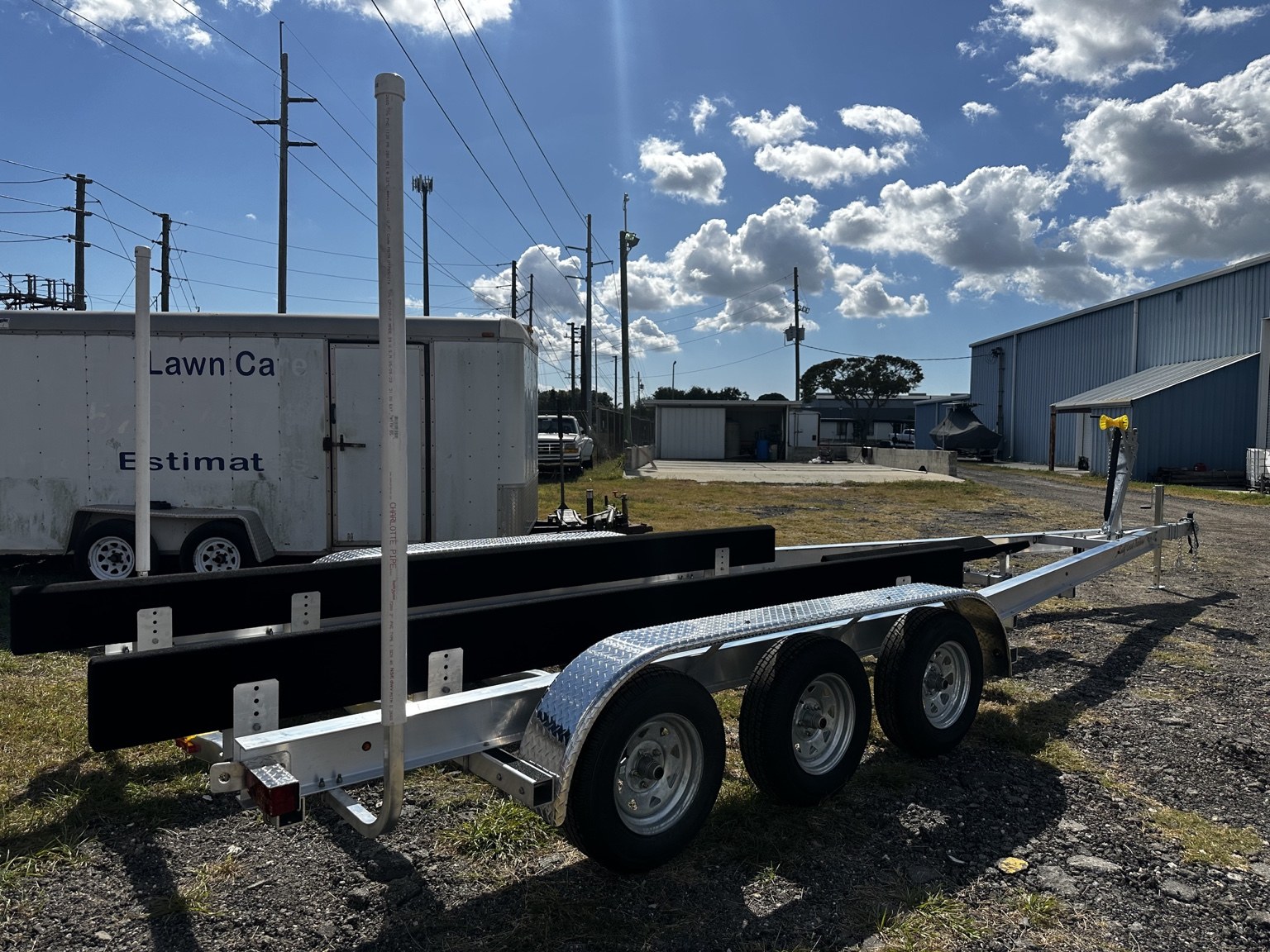 Opposite rear side view of a 10.5K triple-axle trailer