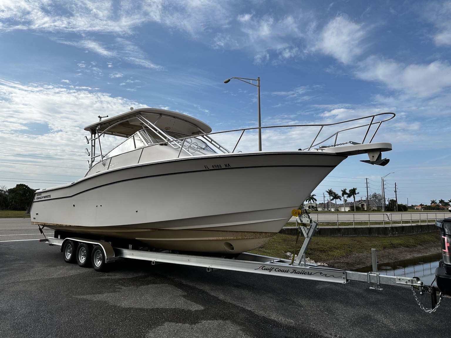 Grady-White walkaround fitted to a Gulf Coast Trailers 15K triple-axle aluminum trailer