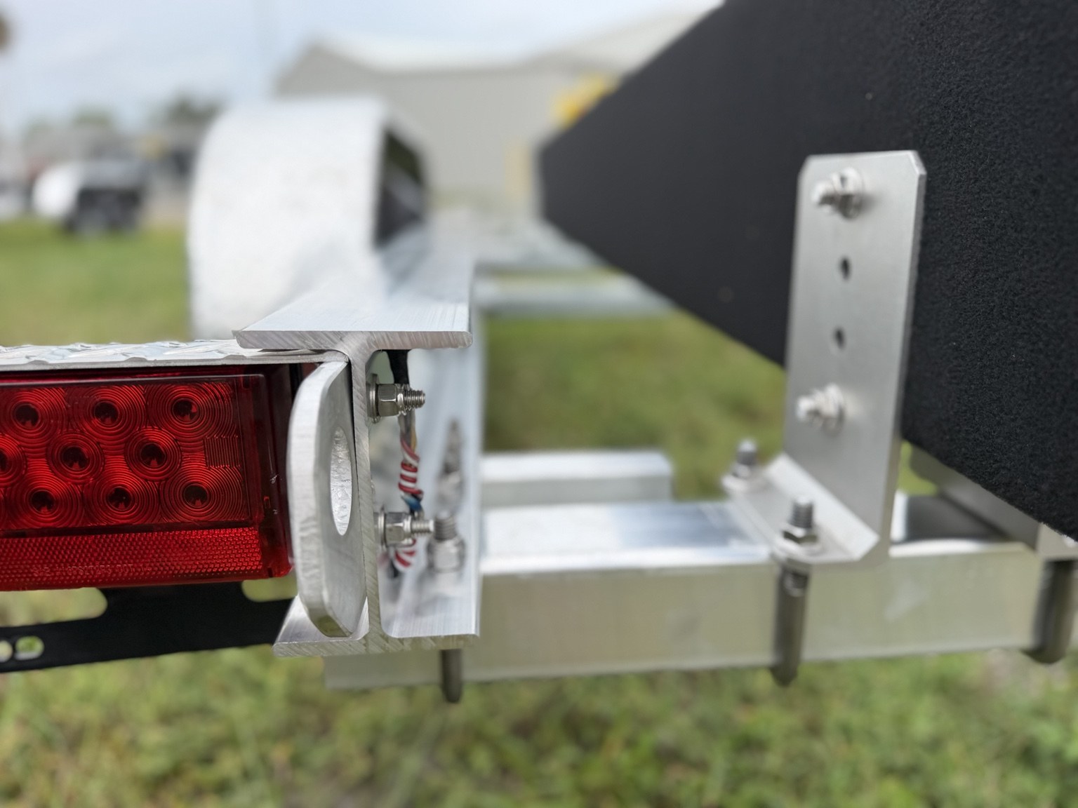 Premium 7K · Rear light and tie-down point